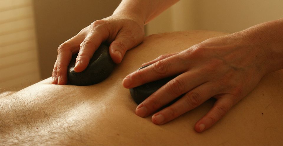 Hot stones on a back