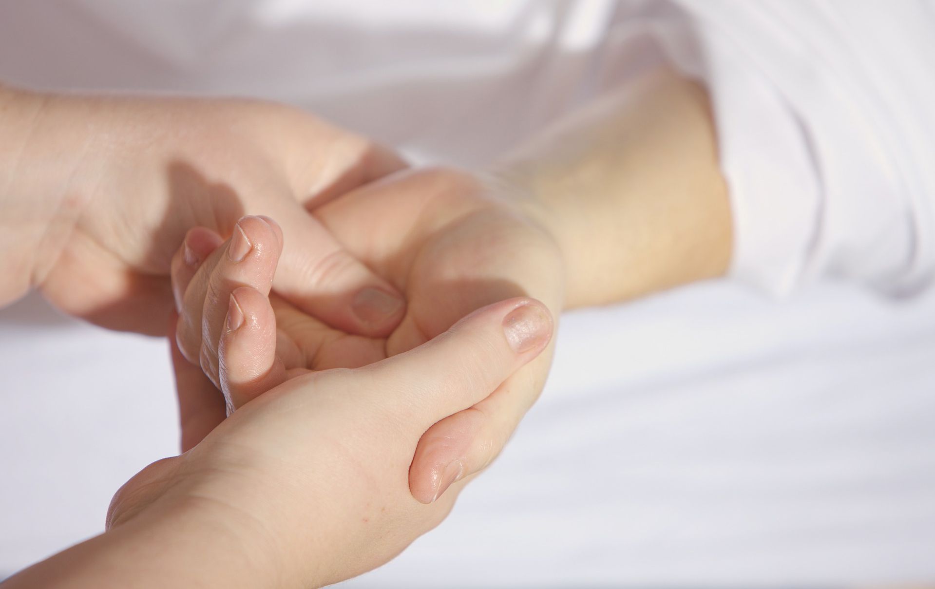 Hands of the masseur during a massage