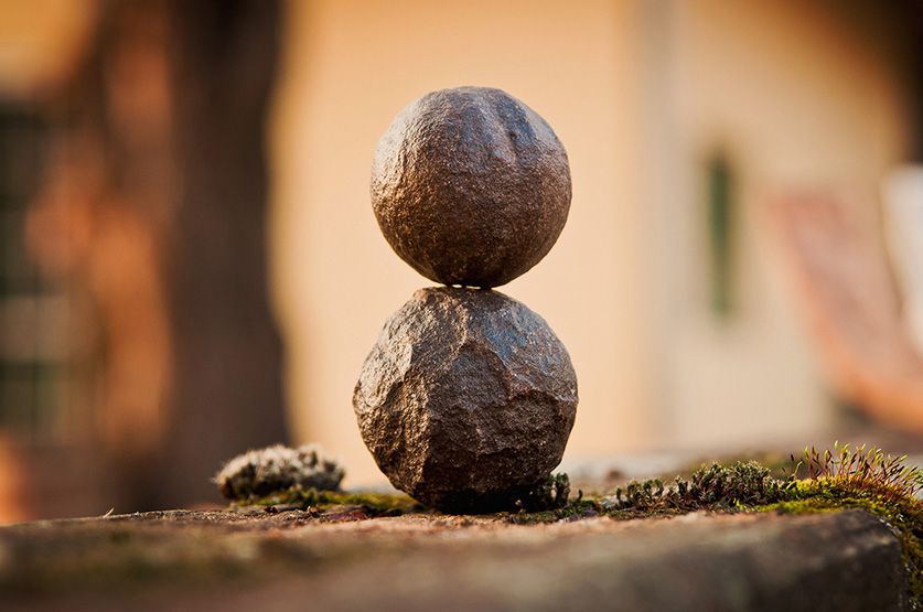 Two massage stones stacked on top of each other